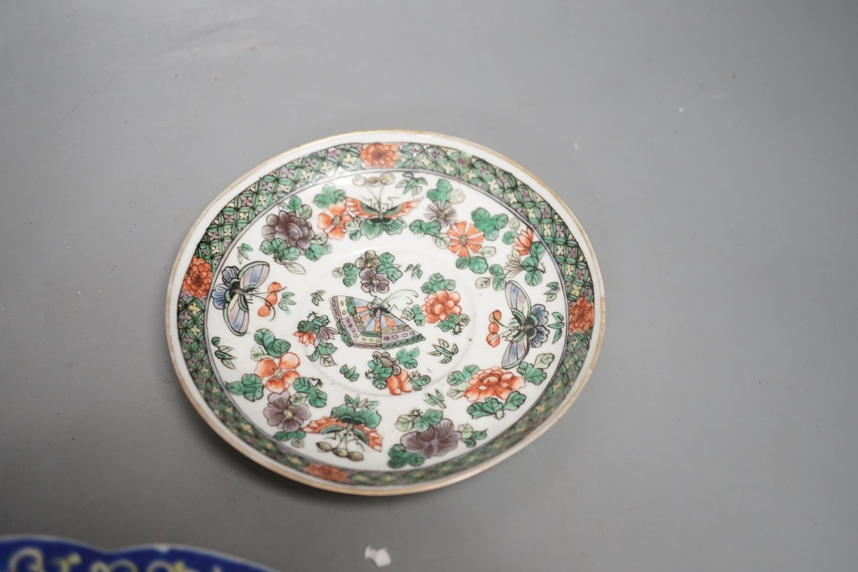 A Chinese blue and white jar, a similar vase, a polychrome plate and a famille verte saucer- plate 25 cms diameter.